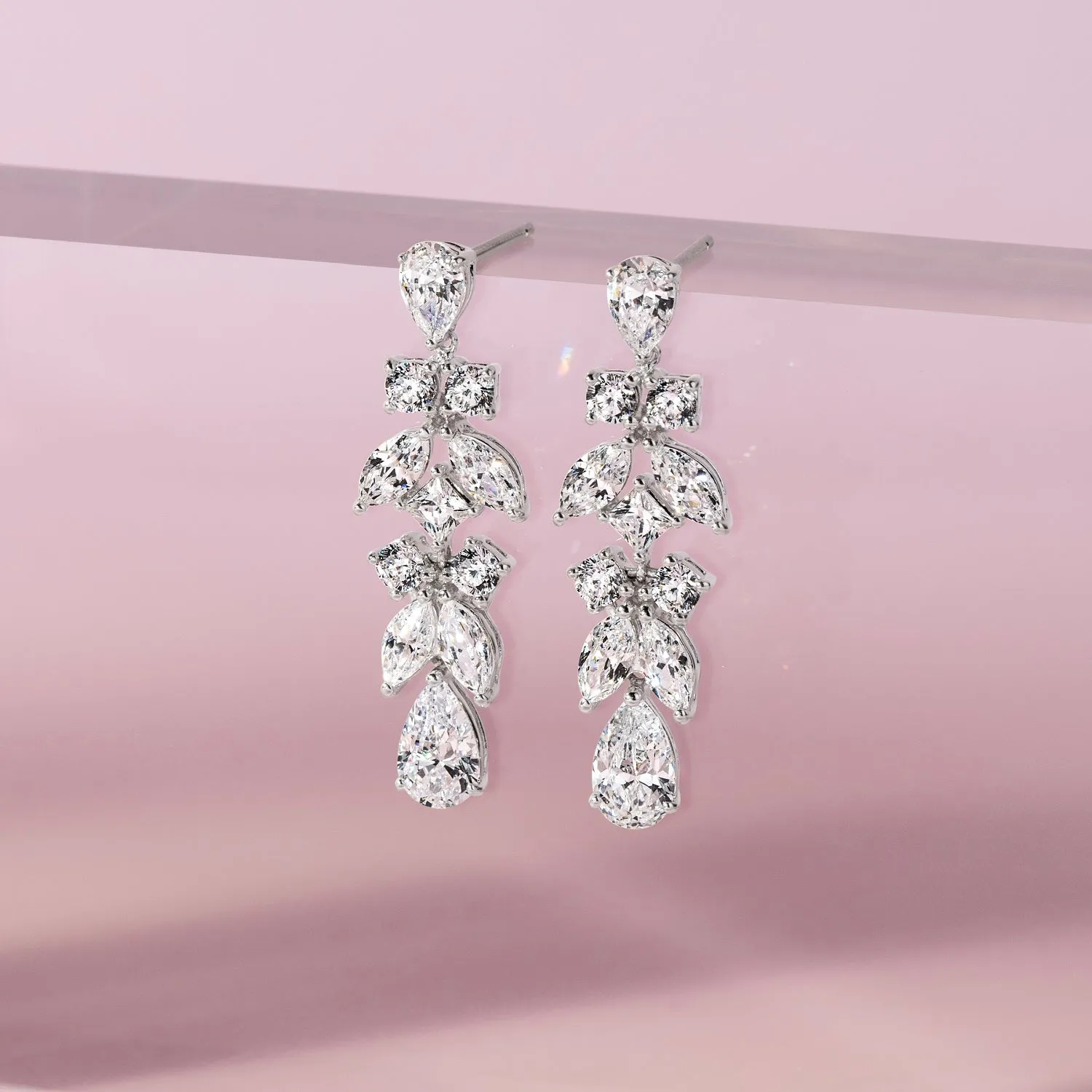 Laureate: Silver rhodium plated multi-shaped pear cut  CZ teardrop earrings